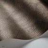 Mineral behang in Metallic Bronze on Soot van Cole & Son