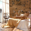 Garzas Textile wallpaper in Ocher by Coordonne — interior