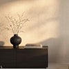 Obsidian Black wallpaper in Light Camel by Greenland — interior